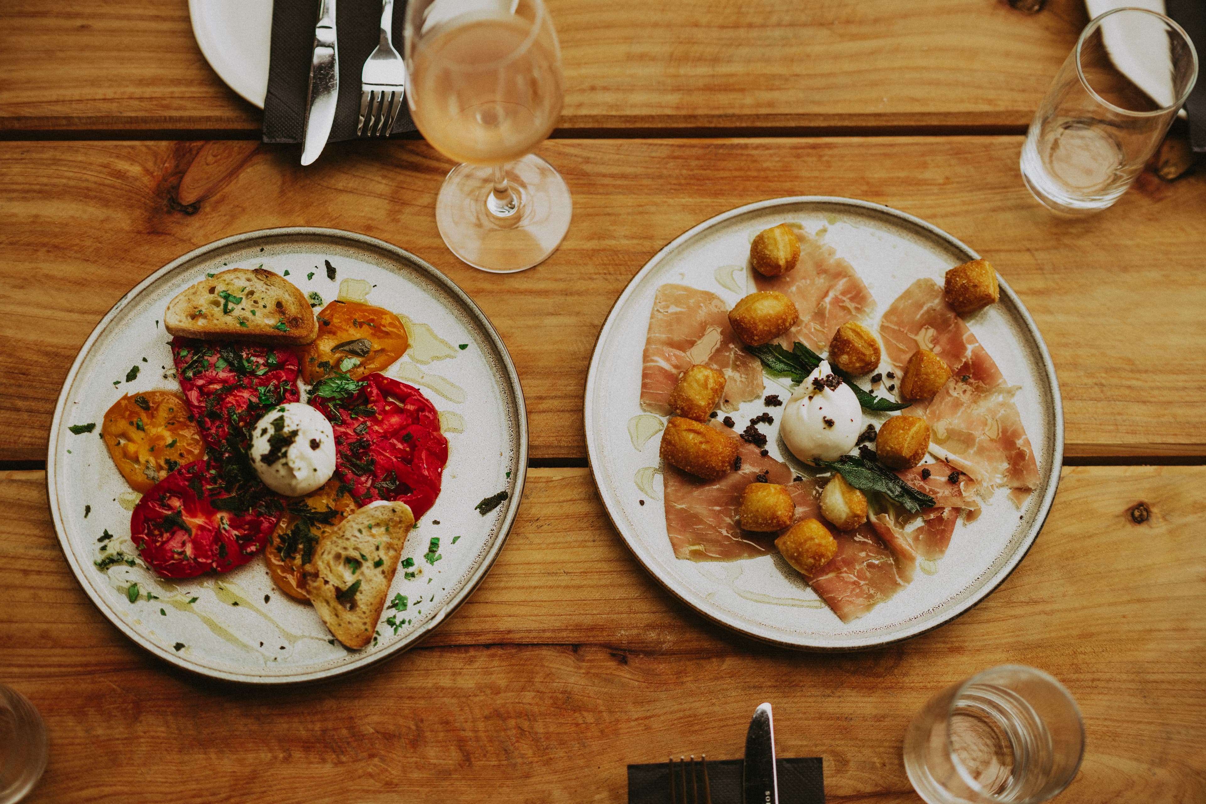 Italian antipasti with burrata, roasted peppers, and grilled bread